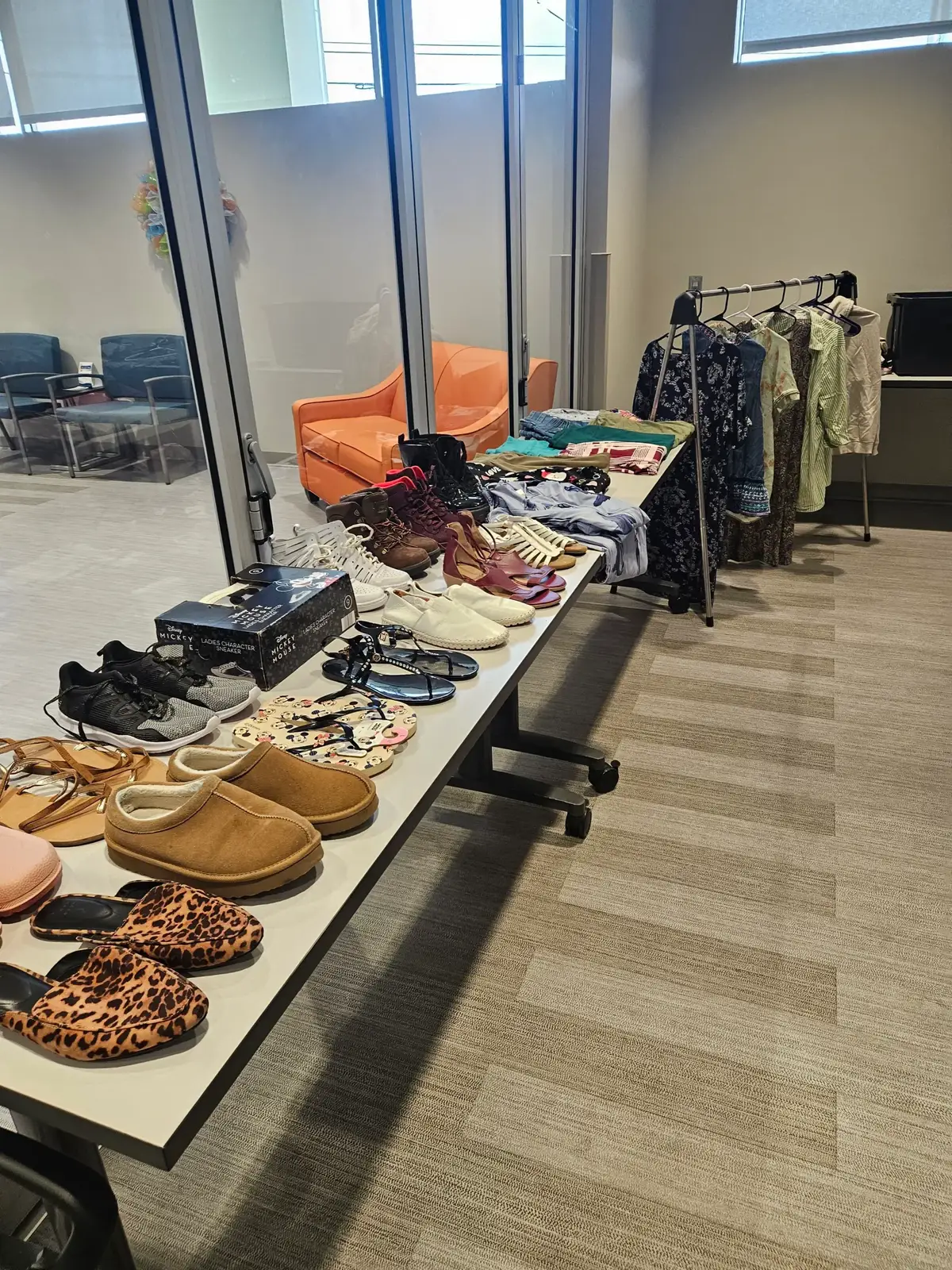 A table filled with shoes available at the Senior Clothes Closet